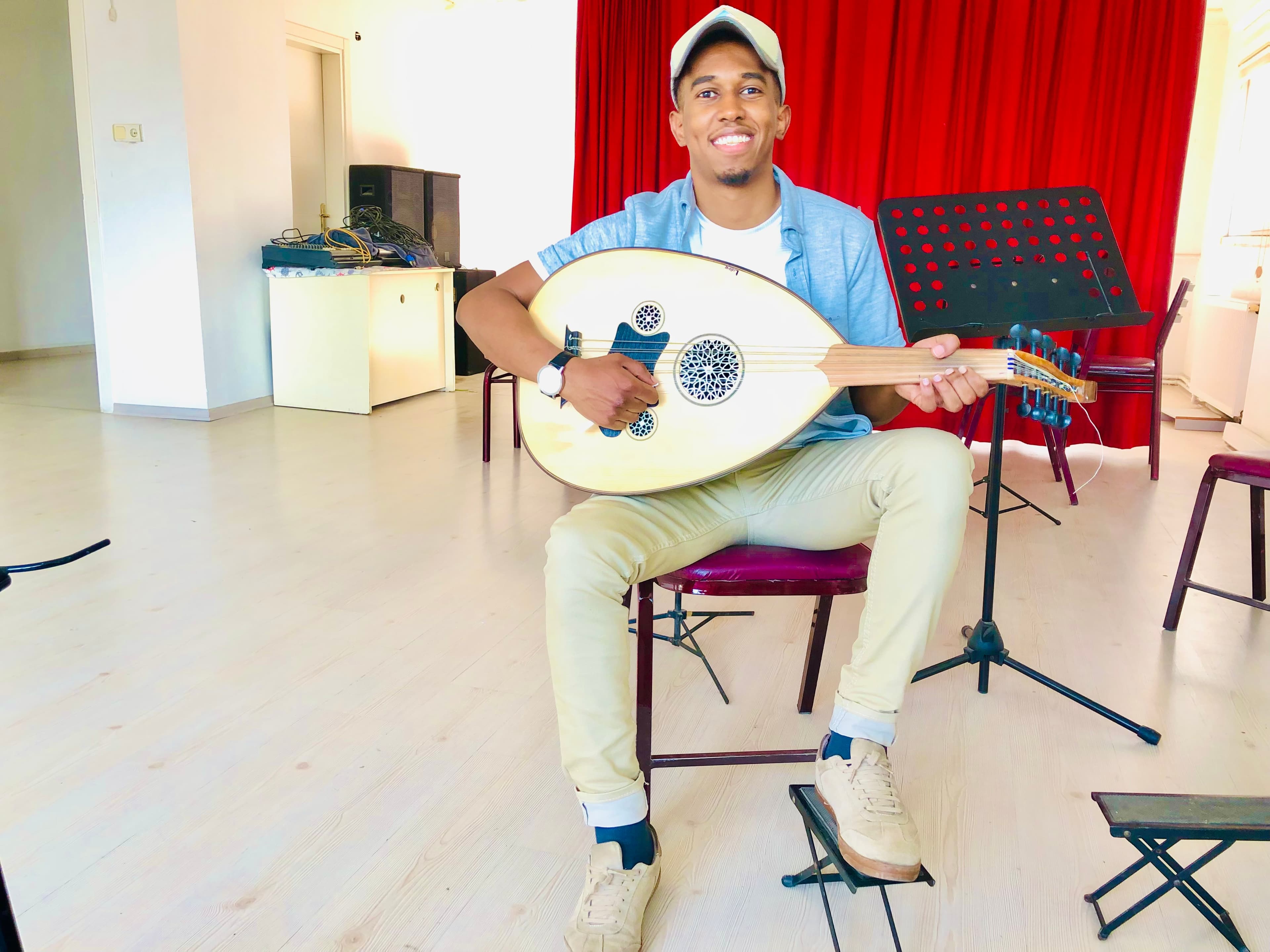 Khalid playing Oud